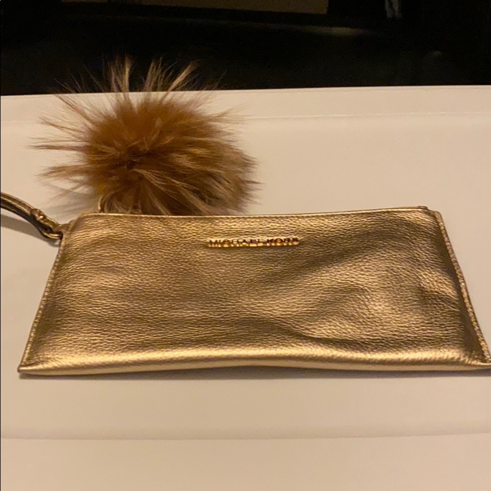 Michael Kors medium clutch like new. Used twice
